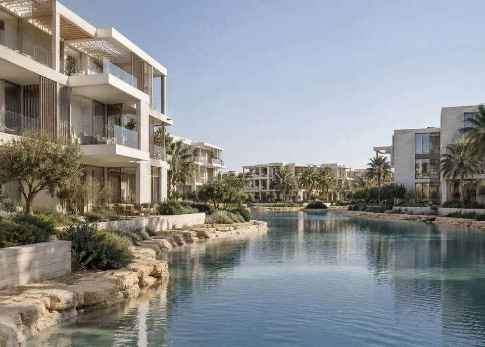 Contemporary waterfront residences arranged around a calm landscaped lagoon
